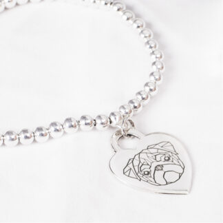 Bracciale con medaglietta cuore in argento con carlino